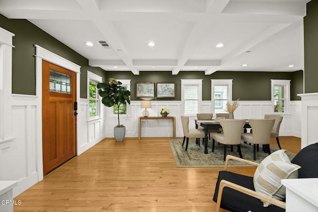 foyer entrance featuring recessed lighting, coffered ceiling, a decorative wall, and beamed ceiling
