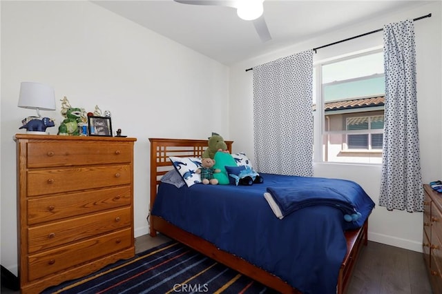bedroom featuring wood finished floors, ceiling fan, and baseboards