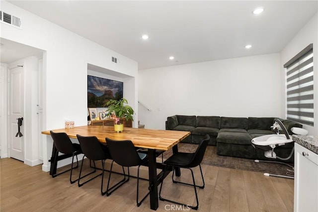 dining area with recessed lighting, visible vents, and light wood-style floors