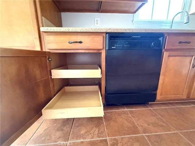 interior details featuring light countertops, a sink, and dishwasher