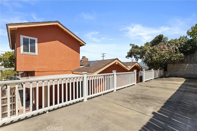 view of patio featuring fence