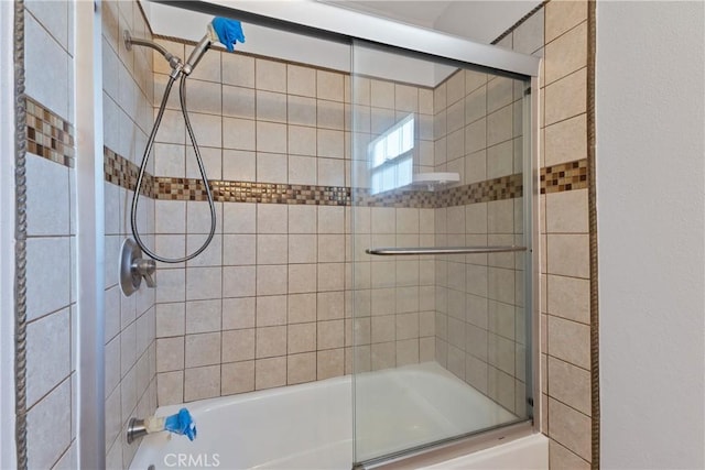 full bath with shower / bath combination with glass door