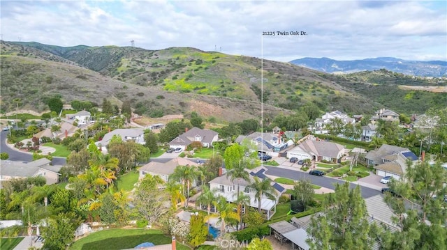 drone / aerial view featuring a mountain view and a residential view