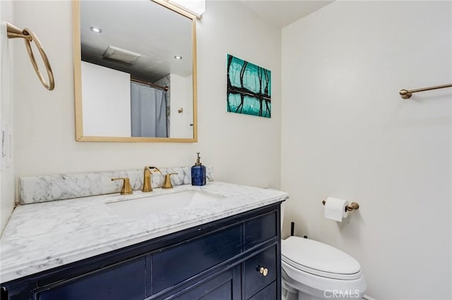 full bath with toilet and vanity