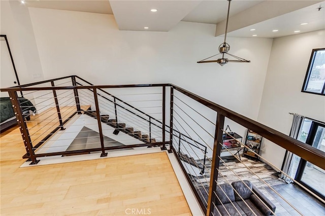 stairs with recessed lighting and a healthy amount of sunlight