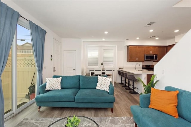 1353 Clary Ct, Upland, CA 91786 - living area with light wood finished floors and recessed lighting