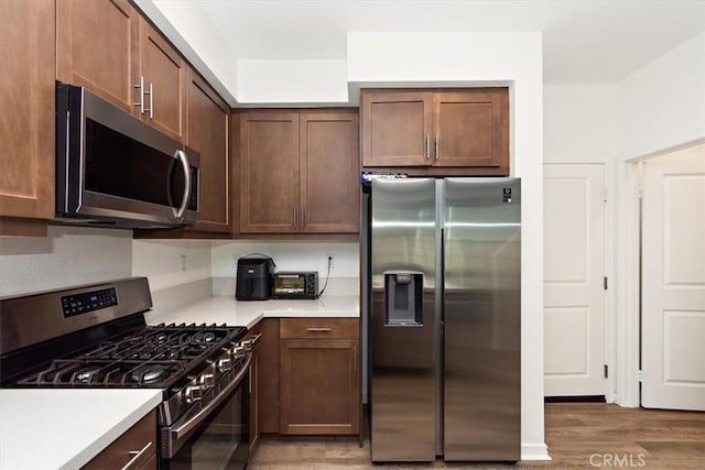 1353 Clary Ct, Upland, CA 91786 - kitchen featuring stainless steel appliances, light wood-style flooring, and light countertops