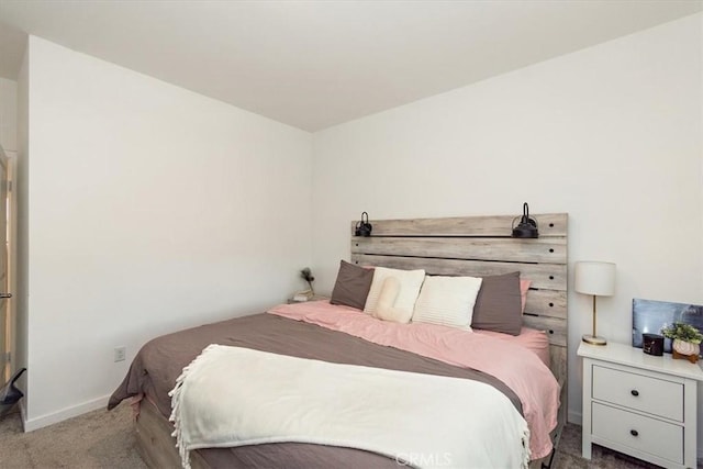 carpeted bedroom with baseboards