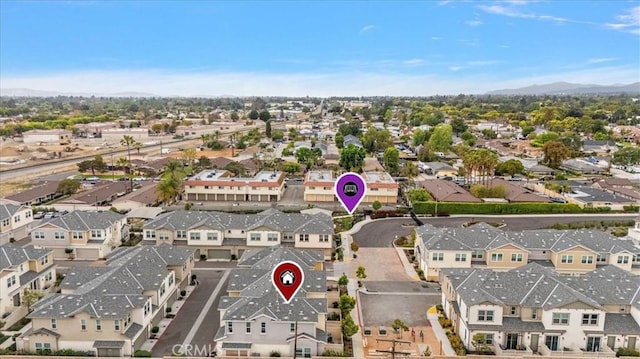 drone / aerial view with a residential view and a mountain view