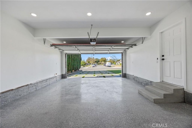 garage featuring a garage door opener and recessed lighting