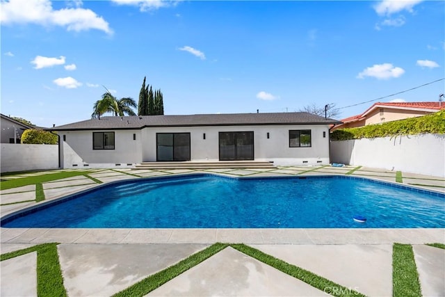 view of swimming pool with a fenced in pool, fence private yard, and a patio area