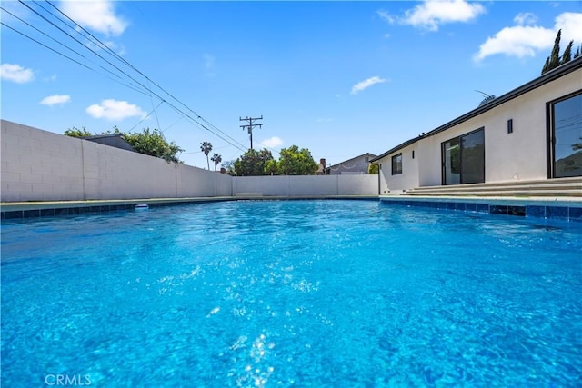 view of pool with fence and a fenced in pool