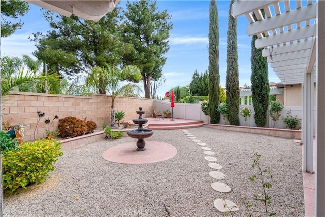 view of yard featuring a fenced backyard, a patio, and a pergola
