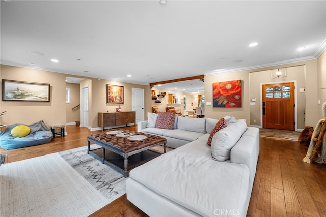 24848 Matterhorn Ct, Crestline, CA 92325 - living room featuring ornamental molding, recessed lighting, and wood finished floors