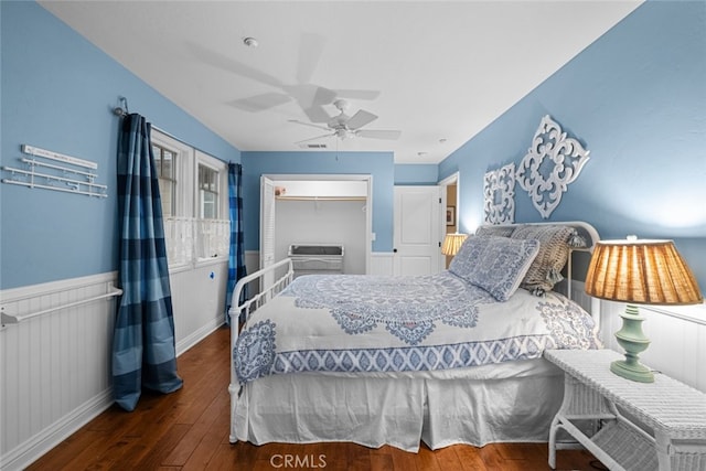 24848 Matterhorn Ct, Crestline, CA 92325 - bedroom featuring a closet, hardwood / wood-style flooring, a ceiling fan, and wainscoting