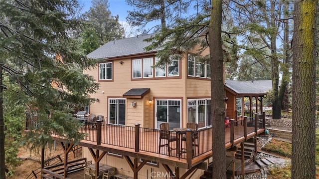 24848 Matterhorn Ct, Crestline, CA 92325 - back of house with a deck, stairway, and roof with shingles