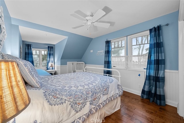 24848 Matterhorn Ct, Crestline, CA 92325 - bedroom featuring ceiling fan, hardwood / wood-style flooring, a wainscoted wall, and vaulted ceiling