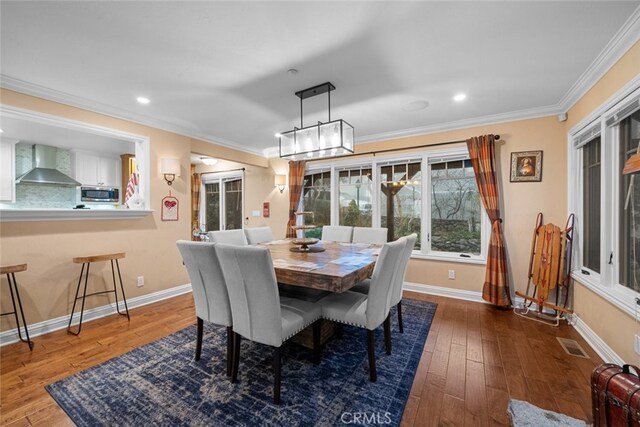 24848 Matterhorn Ct, Crestline, CA 92325 - dining area featuring hardwood / wood-style floors, baseboards, and ornamental molding