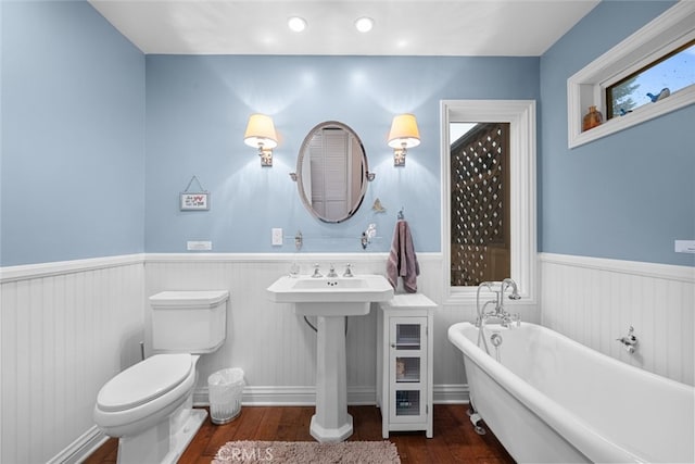 24848 Matterhorn Ct, Crestline, CA 92325 - full bathroom with toilet, a freestanding bath, hardwood / wood-style floors, and wainscoting