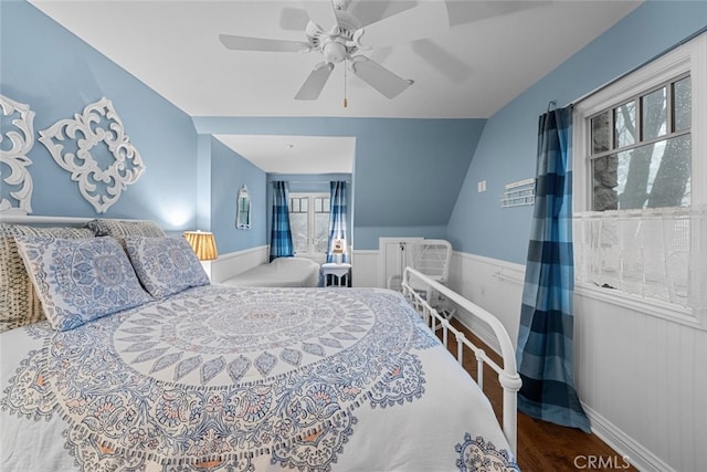 24848 Matterhorn Ct, Crestline, CA 92325 - bedroom with a wainscoted wall, a ceiling fan, lofted ceiling, and wood finished floors