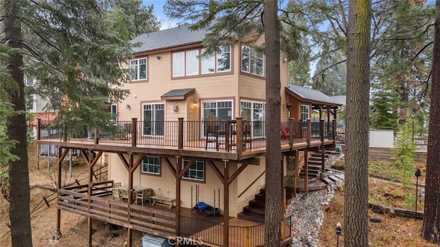 24848 Matterhorn Ct, Crestline, CA 92325 - rear view of house with a deck and stairs