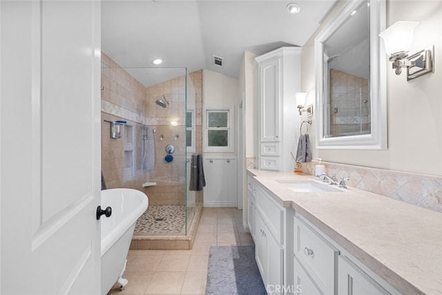 24848 Matterhorn Ct, Crestline, CA 92325 - full bath with vanity, a stall shower, visible vents, tile patterned flooring, and lofted ceiling