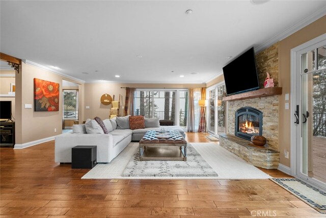 24848 Matterhorn Ct, Crestline, CA 92325 - living area featuring a fireplace, crown molding, and wood-type flooring
