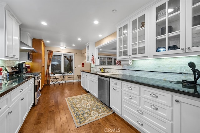 24848 Matterhorn Ct, Crestline, CA 92325 - kitchen featuring white cabinetry, stainless steel appliances, and decorative backsplash