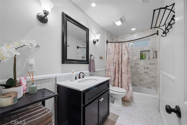 24848 Matterhorn Ct, Crestline, CA 92325 - bathroom with toilet, shower / bath combo, vanity, and wainscoting