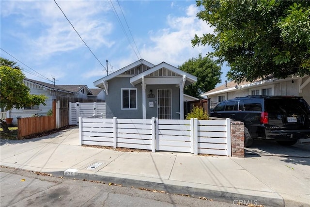 view of front of house featuring a fenced front yard and stucco siding