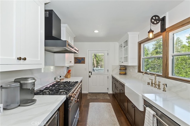 28898 Palisades Dr, Lake Arrowhead, CA 92352 - kitchen with wall chimney exhaust hood, appliances with stainless steel finishes, dark wood finished floors, white cabinets, and glass insert cabinets