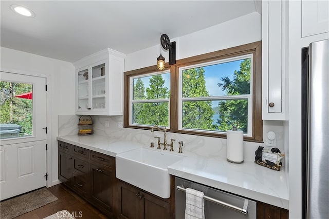 28898 Palisades Dr, Lake Arrowhead, CA 92352 - kitchen featuring appliances with stainless steel finishes, plenty of natural light, glass insert cabinets, and white cabinets