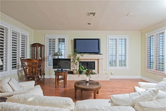 3155 Stone Oak Dr, Los Angeles, CA 90049 - living room featuring crown molding, a wealth of natural light, and wood finished floors