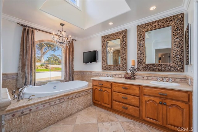 full bath with ornamental molding, a garden tub, a sink, and plenty of natural light