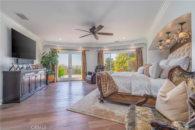 bedroom featuring access to outside, wood-type flooring, visible vents, french doors, and crown molding