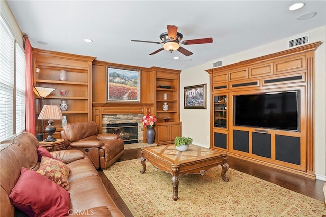 28 Malibu, Irvine, CA 92602 - living room with ceiling fan, wood finished floors, a fireplace, recessed lighting, and built in shelves
