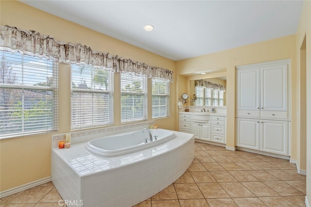 28 Malibu, Irvine, CA 92602 - full bathroom with vanity, a garden tub, healthy amount of natural light, and tile patterned flooring