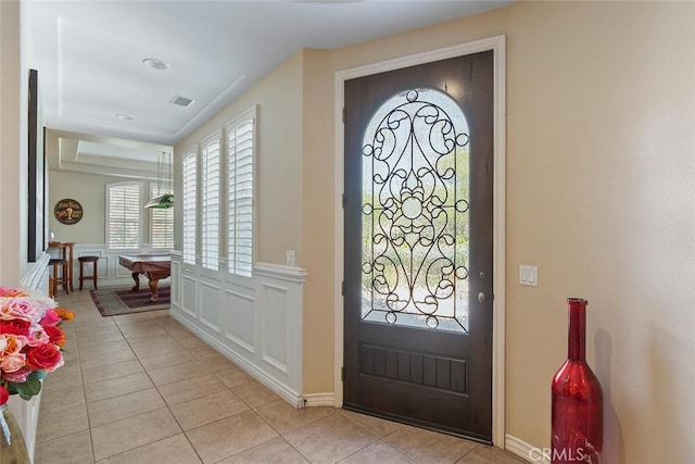 28 Malibu, Irvine, CA 92602 - foyer featuring light tile patterned floors, wainscoting, and a decorative wall