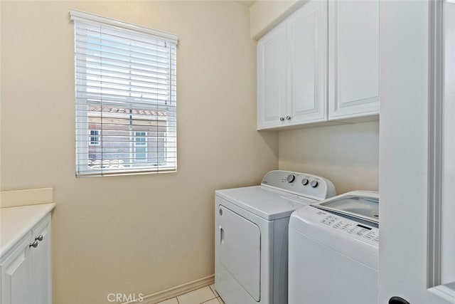 28 Malibu, Irvine, CA 92602 - washroom with cabinet space, separate washer and dryer, and light tile patterned floors