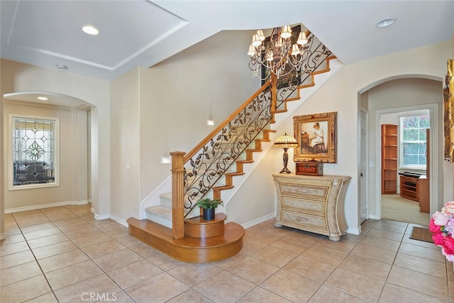 28 Malibu, Irvine, CA 92602 - staircase featuring arched walkways, tile patterned flooring, plenty of natural light, and recessed lighting