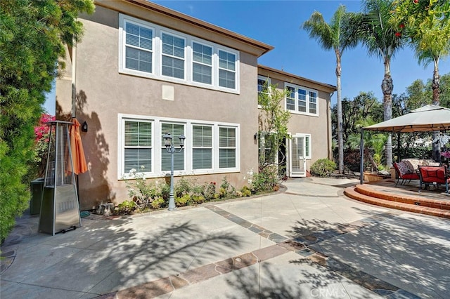28 Malibu, Irvine, CA 92602 - back of property featuring a gazebo, a patio, and stucco siding