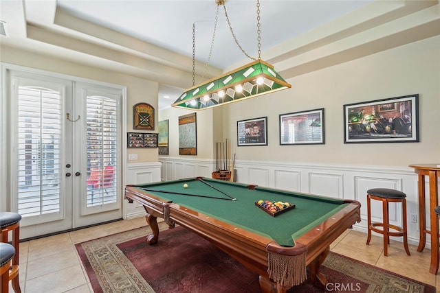 28 Malibu, Irvine, CA 92602 - game room with light tile patterned floors, french doors, a decorative wall, billiards, and a raised ceiling