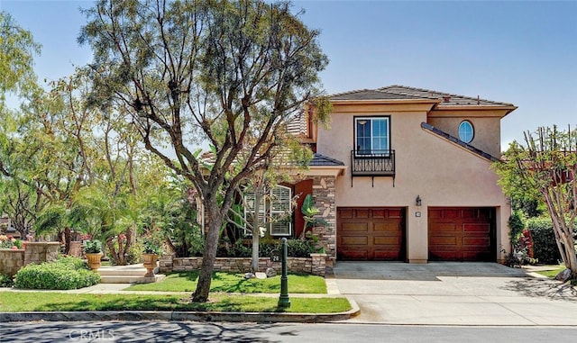 28 Malibu, Irvine, CA 92602 - mediterranean / spanish-style home with stucco siding, concrete driveway, a garage, and stone siding