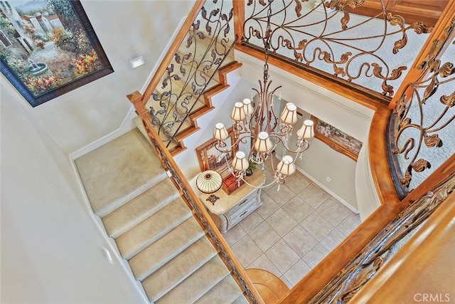 28 Malibu, Irvine, CA 92602 - stairs with tile patterned floors, a chandelier, and a high ceiling