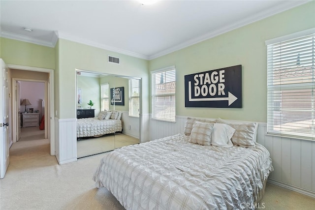 28 Malibu, Irvine, CA 92602 - carpeted bedroom with a wainscoted wall, ornamental molding, and a closet