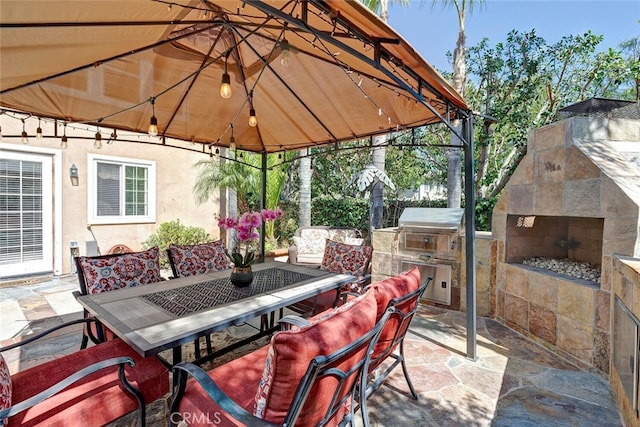 28 Malibu, Irvine, CA 92602 - view of patio with outdoor dining area, a gazebo, area for grilling, and an outdoor fireplace