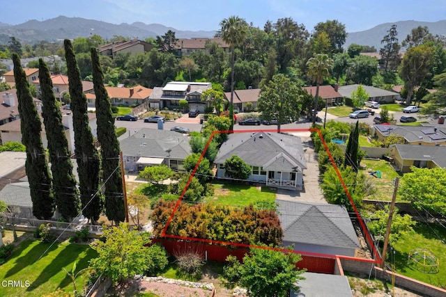 birds eye view of property with a mountain view and a residential view
