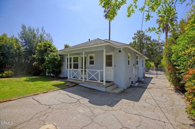 view of outbuilding featuring fence