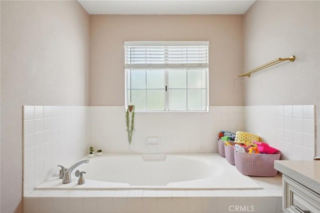 bathroom featuring a bath and vanity