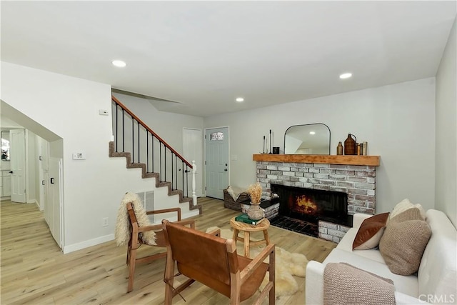 377 Hillside Rd, Lake Arrowhead, CA 92352 - living room featuring light wood-style floors, a fireplace, stairway, and recessed lighting